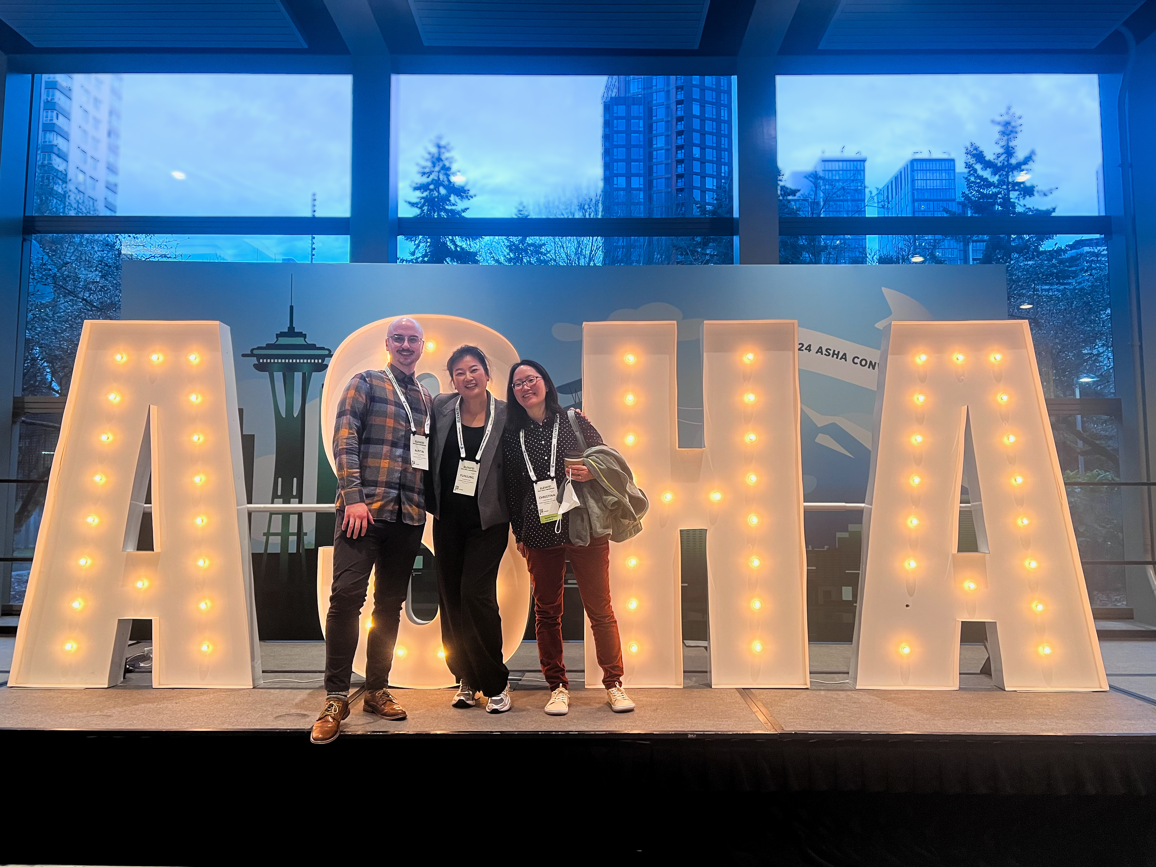 Me, Yun, and Christina Kou in front of the ASHA sign.